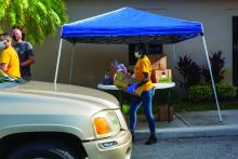 A food distribution site in Tamarac, Fla., is indicative of food insecurity, a result of job layoffs and income disparity linked with the COVID-19 pandemic.
